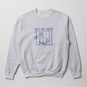 A gray sweatshirt with a graphic design featuring a cartoon duck inside a blue cage, along with the text 