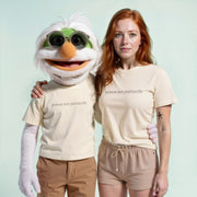 A person wearing a white t-shirt with the text 