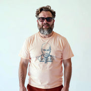 A man with a beard wearing a t-shirt with a graphic design and text printed on it.