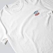 A white t-shirt with a small graphic design on the front.