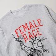 A gray sweatshirt with a graphic design featuring a stylized depiction of the Statue of Liberty and the text 