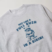 A gray sweatshirt with a graphic design featuring a raccoon wearing a bikini and the text 