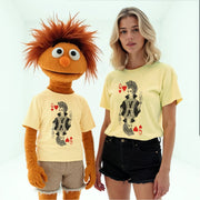 a woman wearing a yellow t-shirt with a graphic of a character and a mannequin wearing a yellow t-shirt with a graphic of a character.