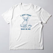 A white t-shirt with a graphic design depicting a small dog smoking a cigarette and holding a cup of coffee. The text above the dog reads 