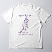 A white t-shirt with a graphic design depicting a frog wearing a witch's hat and holding a broom, along with the text 