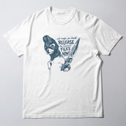 A white t-shirt with a graphic design depicting a character wearing a mask and holding a pair of scissors, along with text that reads 