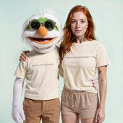 A person wearing a white t-shirt with the text 