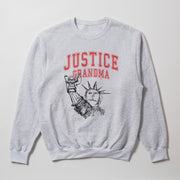 A grey sweatshirt with a graphic design featuring the Statue of Liberty and the text 