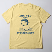 A yellow t-shirt with a graphic design featuring a cartoon rabbit wearing a baseball cap and the text 