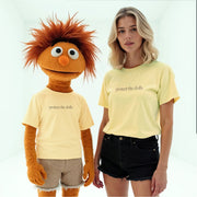 A person wearing a yellow t-shirt with the text 