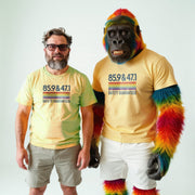 A man and a gorilla wearing matching yellow t-shirts with the number 559.477 printed on them.