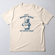 A white t-shirt with a graphic design featuring a bear holding a cup of coffee and the text 