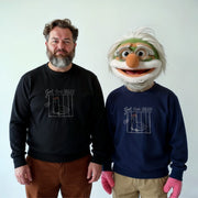 Two men wearing matching black and blue sweatshirts with a graphic of a bird and the text 