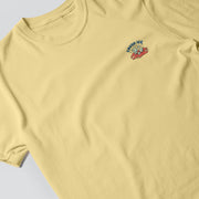 A yellow t-shirt with a small graphic design on the front.