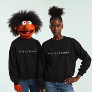 Two people wearing black tops with the text 
