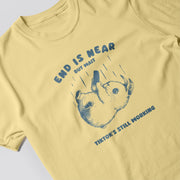 A yellow t-shirt with a graphic design featuring a cartoon rabbit and the text 