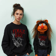 A woman wearing a black sweatshirt with the text 