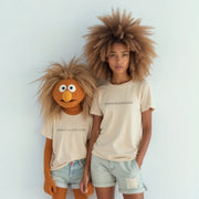 Two individuals wearing matching t-shirts with the text 