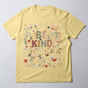 A yellow t-shirt with a floral design and the text 