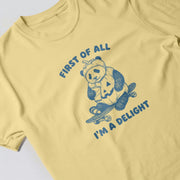 A yellow t-shirt with a graphic design depicting a panda riding a skateboard and the text 
