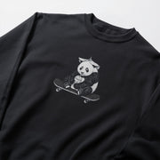 A black sweatshirt with a graphic of a panda riding a skateboard printed on it.