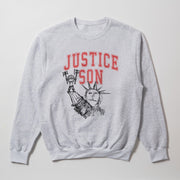 A grey sweatshirt with a graphic design featuring a drawing of the Statue of Liberty and the text 