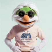A white-haired, green-faced character wearing sunglasses and a pink t-shirt with a graphic of two men and the text 