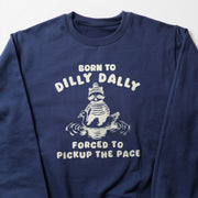 A navy blue sweatshirt with a white graphic design depicting a cartoon raccoon wearing a hat and holding a fish, along with the text 