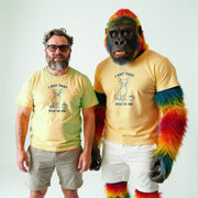 Two men wearing yellow t-shirts with a graphic of a dog and the text 