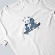 A white t-shirt with a graphic design of a panda riding a skateboard.