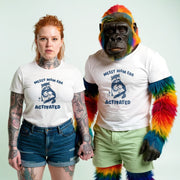 A woman with red hair wearing a white t-shirt with a graphic and text, and a man dressed in a white t-shirt with a graphic and text, standing together.