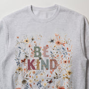 A gray sweatshirt with a colorful floral design and the text 