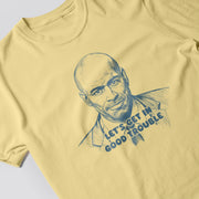 A yellow t-shirt with a blue graphic design depicting a man's face and the text 