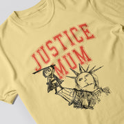 A yellow t-shirt with a graphic design featuring a person holding a sword and a drawing of the Statue of Liberty.