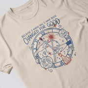 The image is a t-shirt with a graphic design featuring a clock and various celestial elements, along with the text 