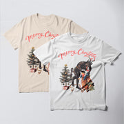 two t-shirts with Christmas-themed designs. The t-shirt on the left is a beige color, while the t-shirt on the right is white. Both t-shirts have a Christmas tree and presents as part of their design.
