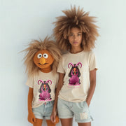 Two people wearing matching t-shirts with a cartoon character design stand together against a white background.