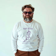 A man wearing a white long-sleeved shirt with a graphic design and text printed on it.