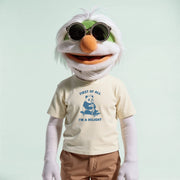 A white, furry character with a green head and sunglasses is wearing a yellow t-shirt with a panda graphic and the text 