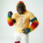 A person wearing a yellow t-shirt with a graphic and text, and a colorful, furry costume with a monkey-like design.