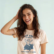 A smiling woman with long brown hair wearing a t-shirt with a graphic of a sloth and the text 