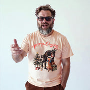 A man with a beard and glasses is wearing a t-shirt with a Christmas-themed graphic and is gesturing with his hand.