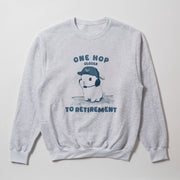 A gray sweatshirt with a graphic design depicting a rabbit wearing a baseball cap and the text 