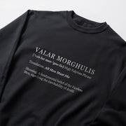 a black long-sleeved shirt with white text printed on it.