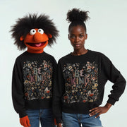 Two people wearing matching black sweatshirts with the text 