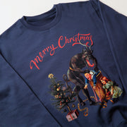 A navy blue sweatshirt with a Christmas-themed graphic design featuring a dark figure, a Christmas tree, and a woman in a green dress.