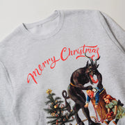 A grey sweatshirt with a Christmas-themed graphic design featuring a dark figure, a Christmas tree, and a person in a blue outfit.