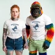 A woman with red hair wearing a white t-shirt with a bird graphic and the text 