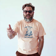 A man with a beard and glasses is wearing a t-shirt with a graphic of a panda and the text 