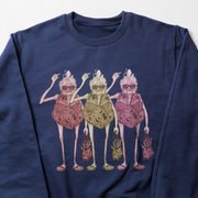 A blue long-sleeved shirt with a graphic design depicting three stylized human figures in a group.